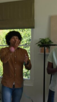 Vertical video: Tailor wrapping tape around neck after thumbsup for fitting tying tie, copy space