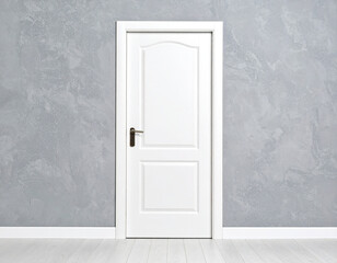 White door mock up isolated on gray wall background, copy space