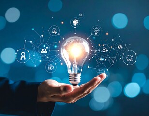 Hand holding a glowing lightbulb with interconnected network graphics