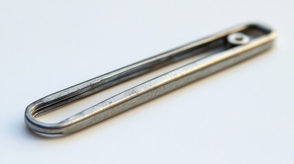 Metal utensil on white background, close-up view