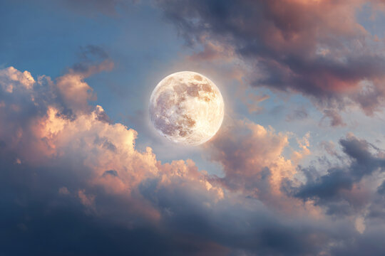 a full moon is seen in the sky