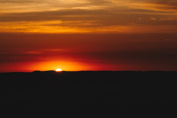 Golden sunset over the vast dunes of the Ica Desert near Huacachina, Peru.