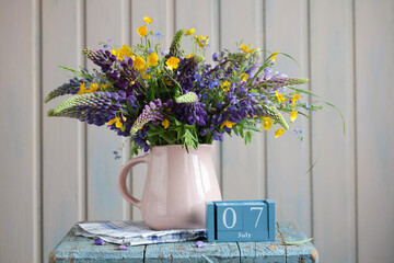 Lupine bouquet in pink jug celebrating july 7th