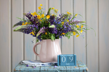 Lupine bouquet in pink jug celebrating july 9th