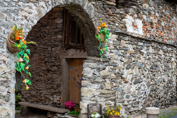 Ancient stone arches, weathered walls, medieval charm, Italian old town atmosphere, timeless travel destination region Piedmont, Old European district