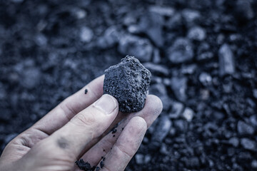 coal in the hand. Coal in the Hand of Miners. Mining Industry Concept. Heavy Industry. Heating. Mineral Raw Materials. Natural Resources