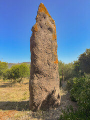 Ancient standing stone Menhir of Luxia Arrabiosa in southern Sardinia