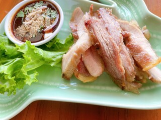 Tender grilled pork served with spicy Northeastern Thai dipping sauce “Jaew.” Rich, smoky, and packed with flavor.