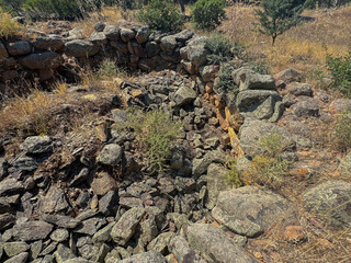 Ancient stone Nuraghe ruins surrounded by nature in southern Sardinia