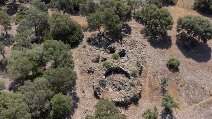 Ancient stone Nuraghe ruins surrounded by nature in southern Sardinia
