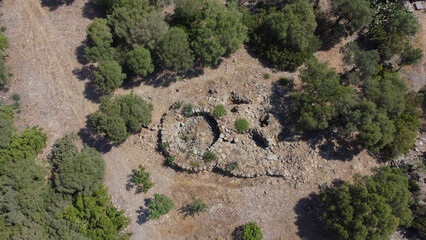 Ancient stone Nuraghe ruins surrounded by nature in southern Sardinia