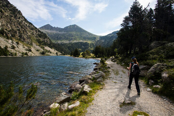 Young hiker woman in Vall de Boi, Aiguestortes and Sant Maurici National Park, Spain