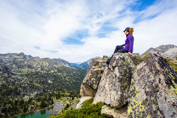 Young hiker woman in Vall de Boi, Aiguestortes and Sant Maurici National Park, Spain