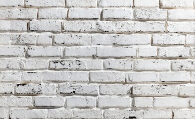 Fototapeta premium A white painted brick wall with a slightly rough texture and visible mortar lines, showing subtle signs of wear and weathering.