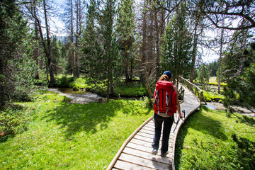 Young hiker woman in Vall de Boi, Aiguestortes and Sant Maurici National Park, Spain