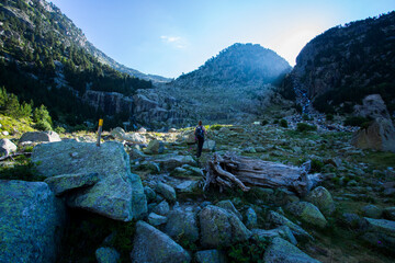 Young hiker woman in Vall de Boi, Aiguestortes and Sant Maurici National Park, Spain