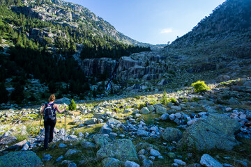 Young hiker woman in Vall de Boi, Aiguestortes and Sant Maurici National Park, Spain