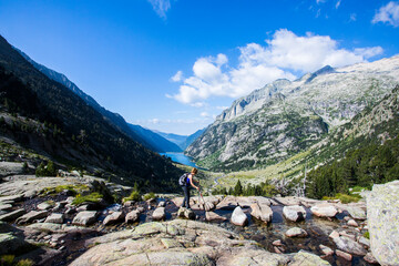 Young hiker woman in Vall de Boi, Aiguestortes and Sant Maurici National Park, Spain
