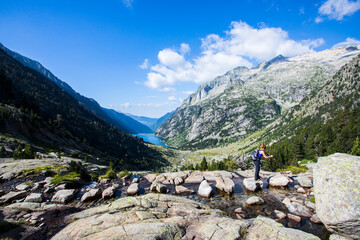 Young hiker woman in Vall de Boi, Aiguestortes and Sant Maurici National Park, Spain