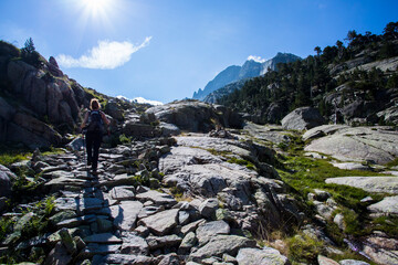 Young hiker woman in Vall de Boi, Aiguestortes and Sant Maurici National Park, Spain