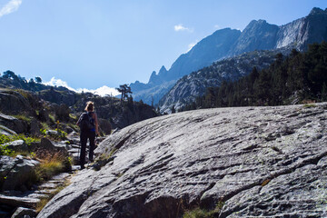 Young hiker woman in Vall de Boi, Aiguestortes and Sant Maurici National Park, Spain