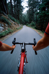 A man is riding a red bicycle down a road