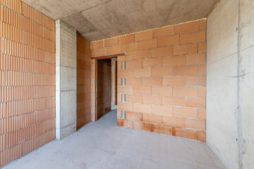  Interior of Unfinished Apartment with Brick Walls and Concrete Ceiling – Under Construction Residential Building, Real Estate Development, Industrial Architecture Background