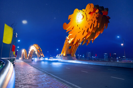 Dragon bridge at night in Da nang Vietnam with illuminated dragon sculpture