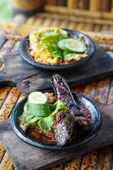 Sambal Gami, Indonesia, captured on June 9, 2025. Traditional spicy chili sauce served on a hot clay plate, made with fresh chilies, garlic, tomatoes, and shrimp paste for bold and smoky flavor.