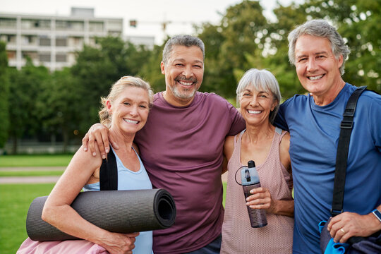 Portrait of happy senior group after fitness workout at park