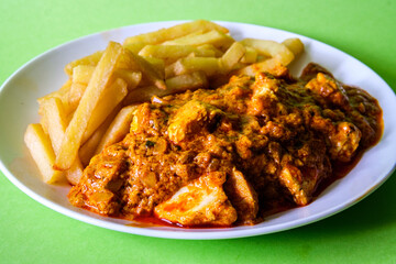  A Plate of Traditional Chicken Tikka Masala With Chips