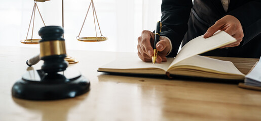A professional lawyer advises a client in a legal office, reviewing contracts and justice symbols...