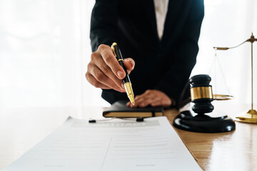 A professional lawyer advises a client in a legal office, reviewing contracts and justice symbols...
