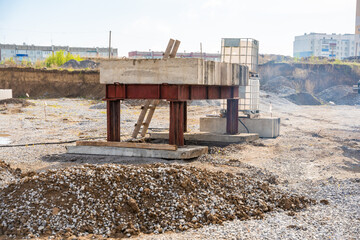 Plate load test in progress with heavy weight applying static pressure on soil. Geotechnical...