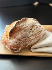  freshly baked sourdough bread with a textured, golden crust.