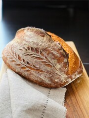  freshly baked sourdough bread with a textured, golden crust.