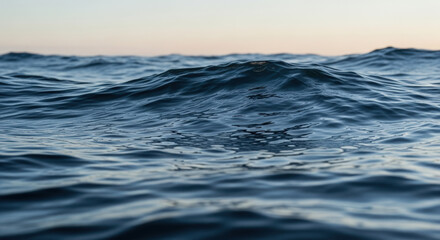 Calm Ocean Waves Under Soft Sky with Gentle Ripples in Clear Water