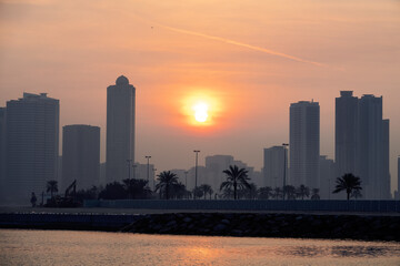 Fototapeta premium The setting sun in the plumes of a sandstorm. Haboob In Dubai
