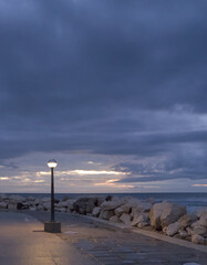 street light during blue hour after sunset on mediterranean coast in istria piran slovenia europe...