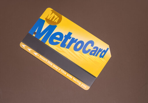 MTA MetroCard isolated on a plain brown background