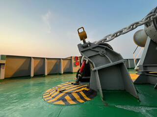 Forward (mooring) deck of the offshore support vessel with the anchor secured. The entire construction serves to manage a heavy anchor and a chain