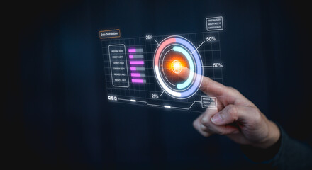 A hand interacts with a futuristic transparent digital interface displaying graphs and data visualizations against a dark background.