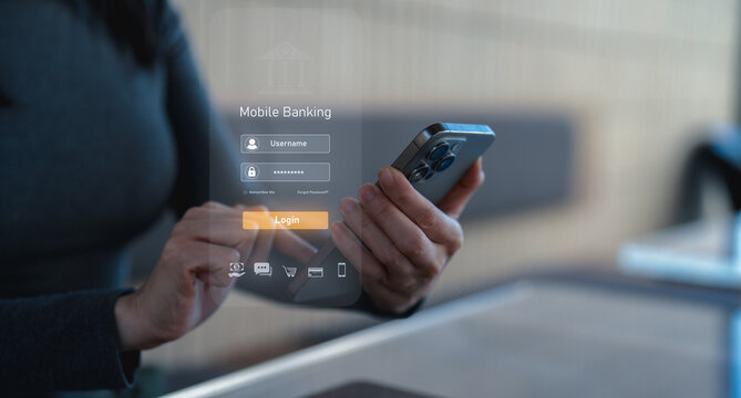 A person accesses mobile banking on a smartphone, entering login credentials on a transparent digital interface.