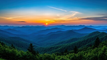 Obraz premium A beautiful sunset over a range of majestic mountains