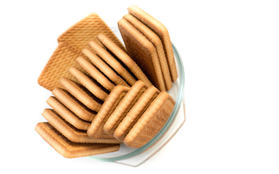 Cookies in a glass plate on a white background.