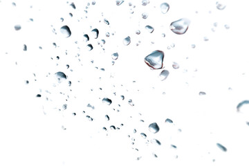 Water Droplets on Glass: Abstract image of many water droplets scattered across a glass surface, showcasing light refraction and surface tension.  