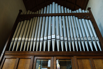 Close up of a pipe organ inside a church