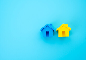 Yellow and blue houses. Symbol and colors of the flag of Ukraine. Ukrainian refugees and forced migrants. Housing construction. Assimilation of refugees in other countries and creation of conditions.