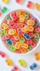 Colorful gummy candies in a white bowl, showcasing a variety of vibrant flavors and shapes. Perfect for candy lovers, parties, or sweet treats for any occasion