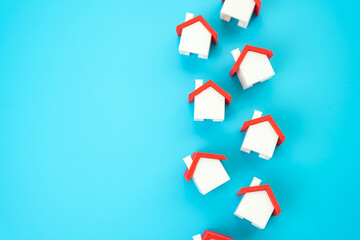A line of house figures. Houses and real estate. Realtors service in buying and selling. Home...